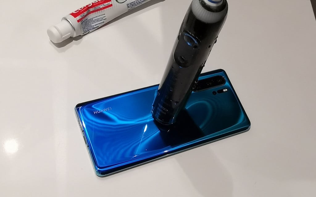 Huawei's P30 Pro recharging an Oral-B electric toothbrush