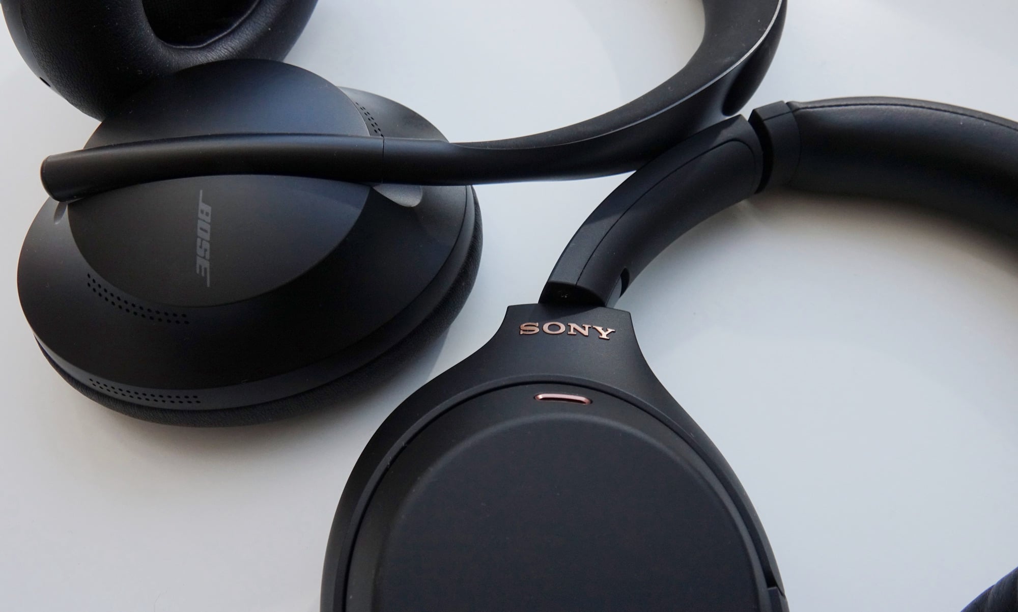Sony WH-1000XM4 headphones next to the Bose 700 Headphones