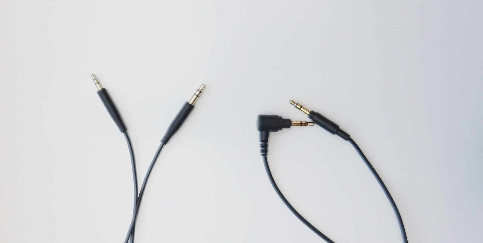 The Bose 700 uses a 2.5mm to 3.5mm cable (left) while the Sony uses a 3.5mm to 3.5mm standard cable (right).