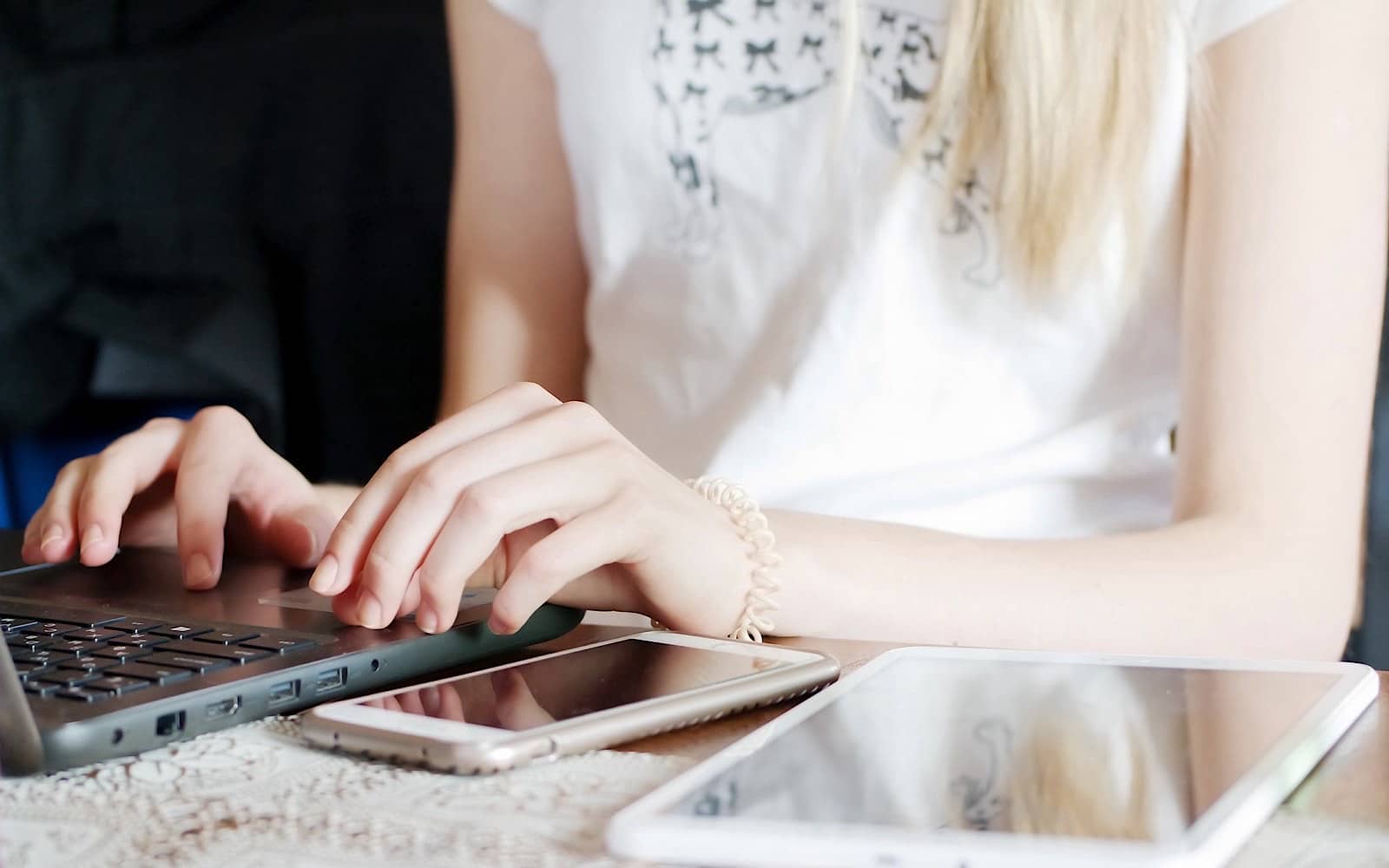 Using a few devices to browse online, including a phone, a computer, and a tablet.