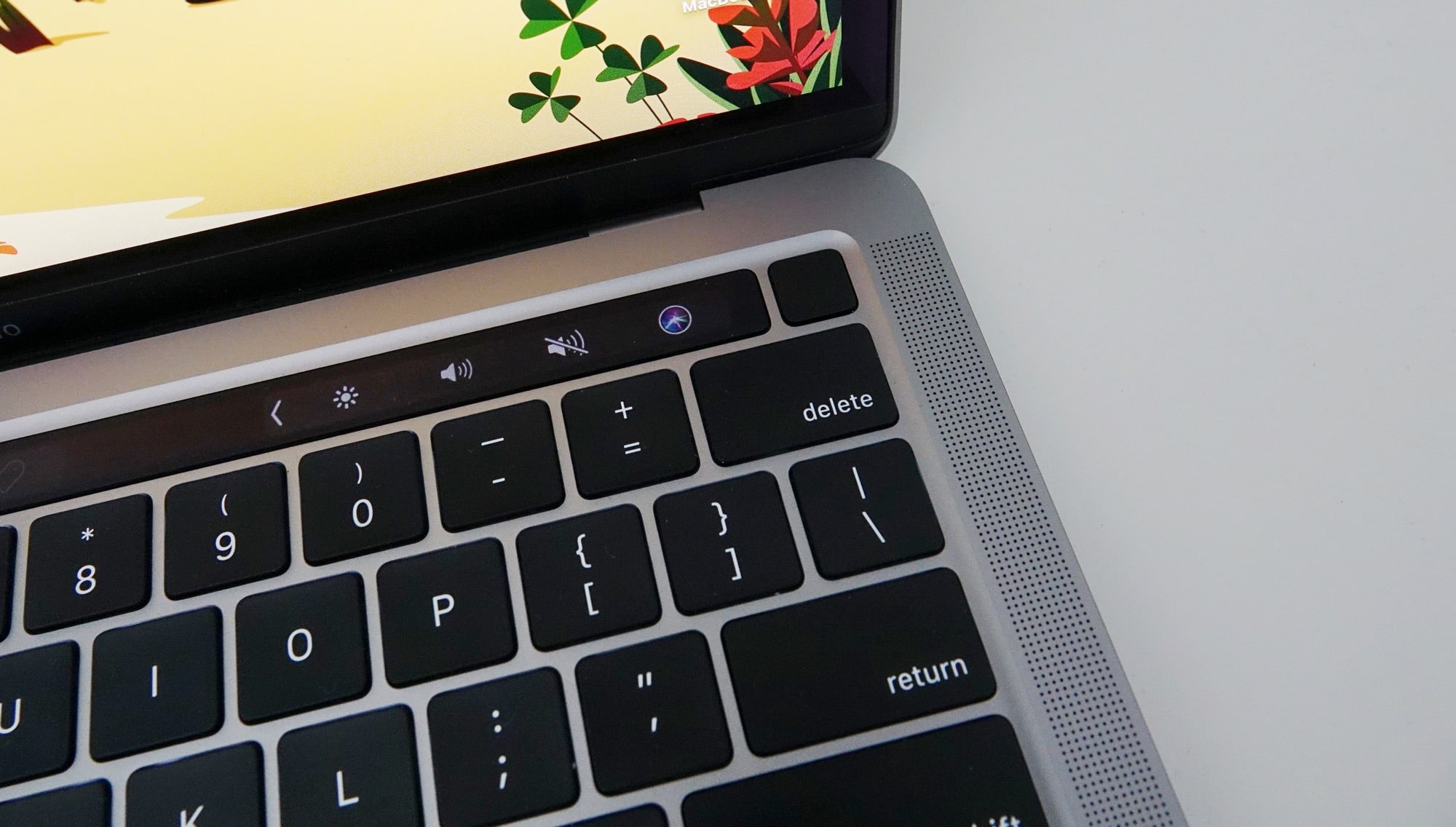 The fingerprint sensor next to the OLED Touch Bar on the 13 inch M1 MBP
