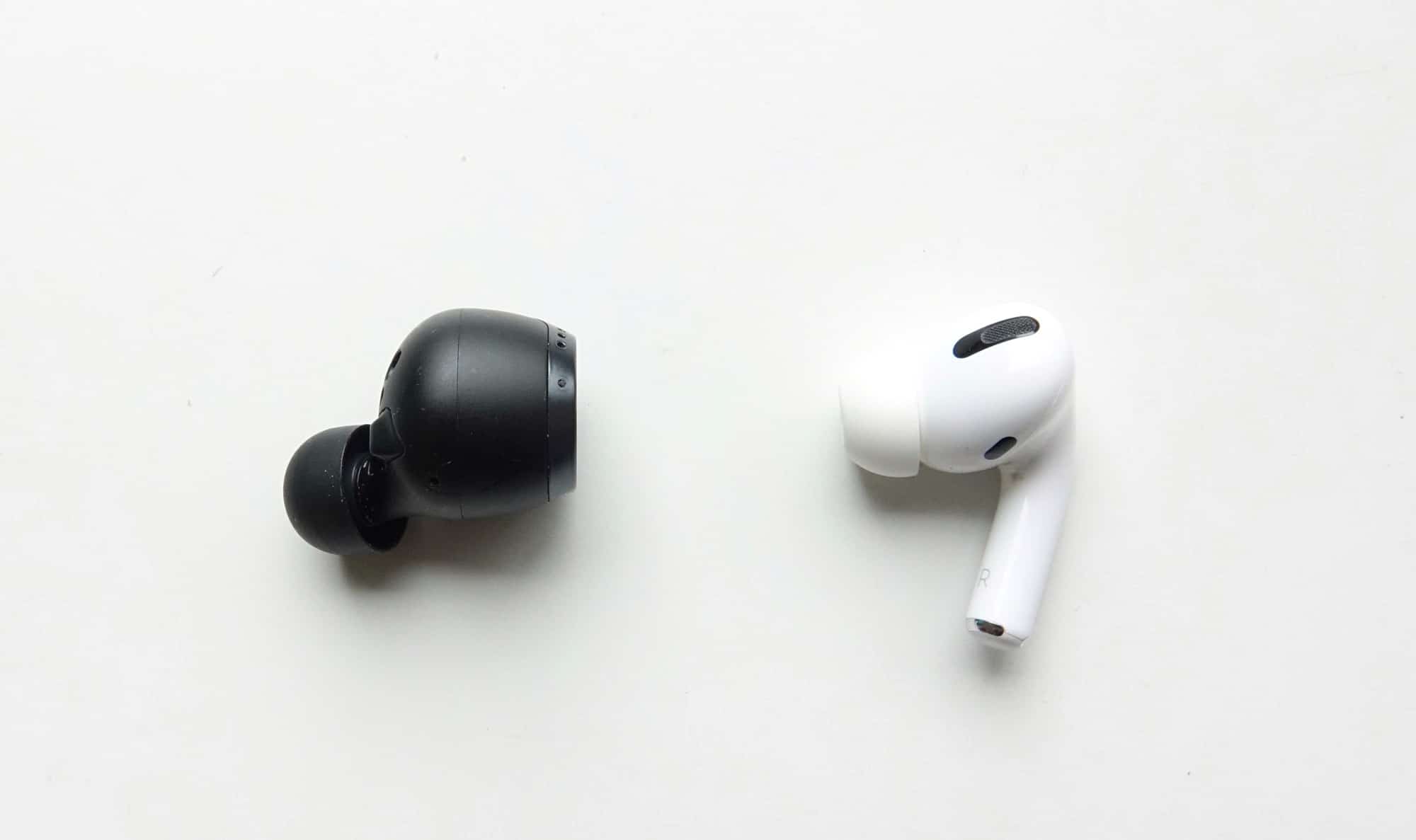 The Technics AZ70W (left) next to the Apple AirPods Pro (right)