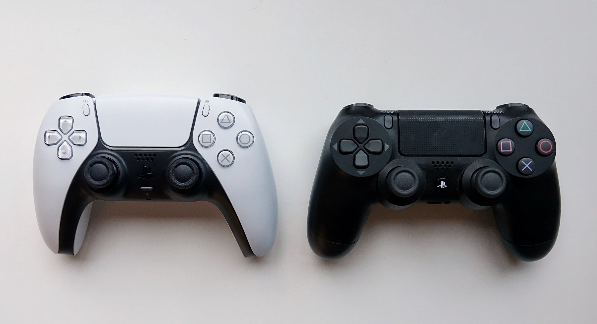 A PS5 controller (left) and a PS4 controller (right)