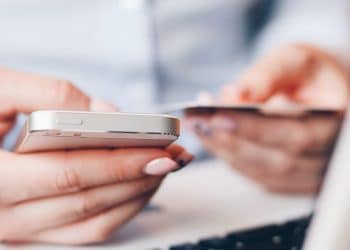 Someone looking at handing over credit card details using their phone