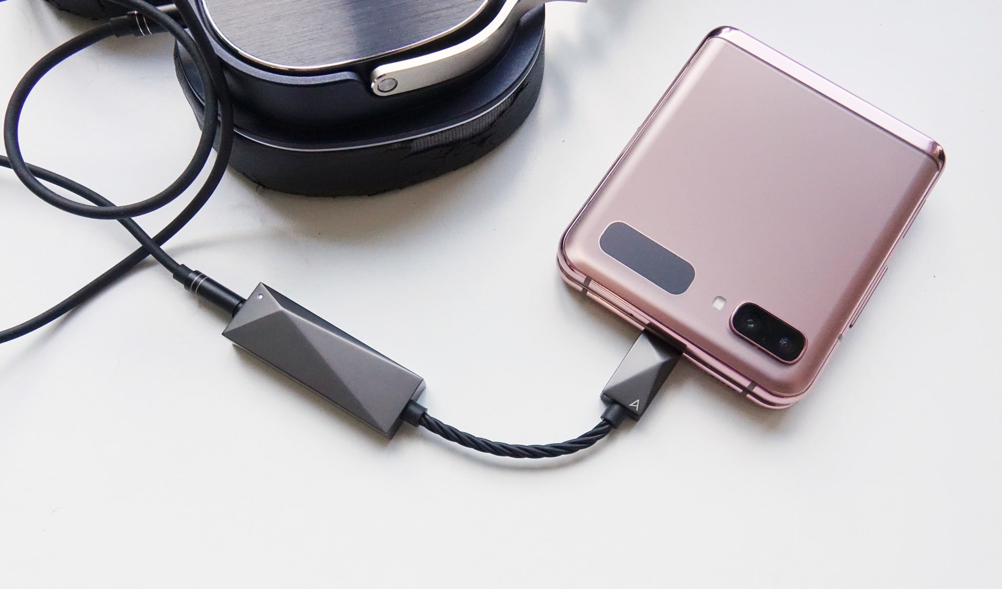 The Astell & Kern DAC Type C Cable plugged into the Galaxy Z Flip and Oppo PM-3
