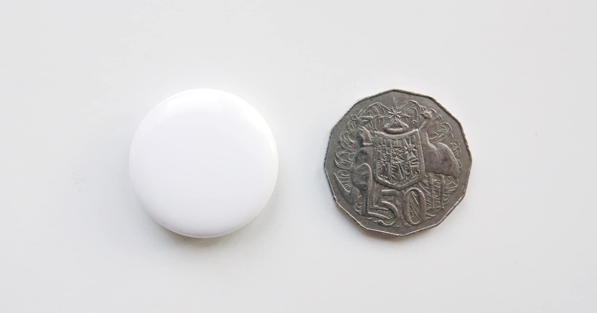 An AirTag is the size of an Australian 50 cent coin