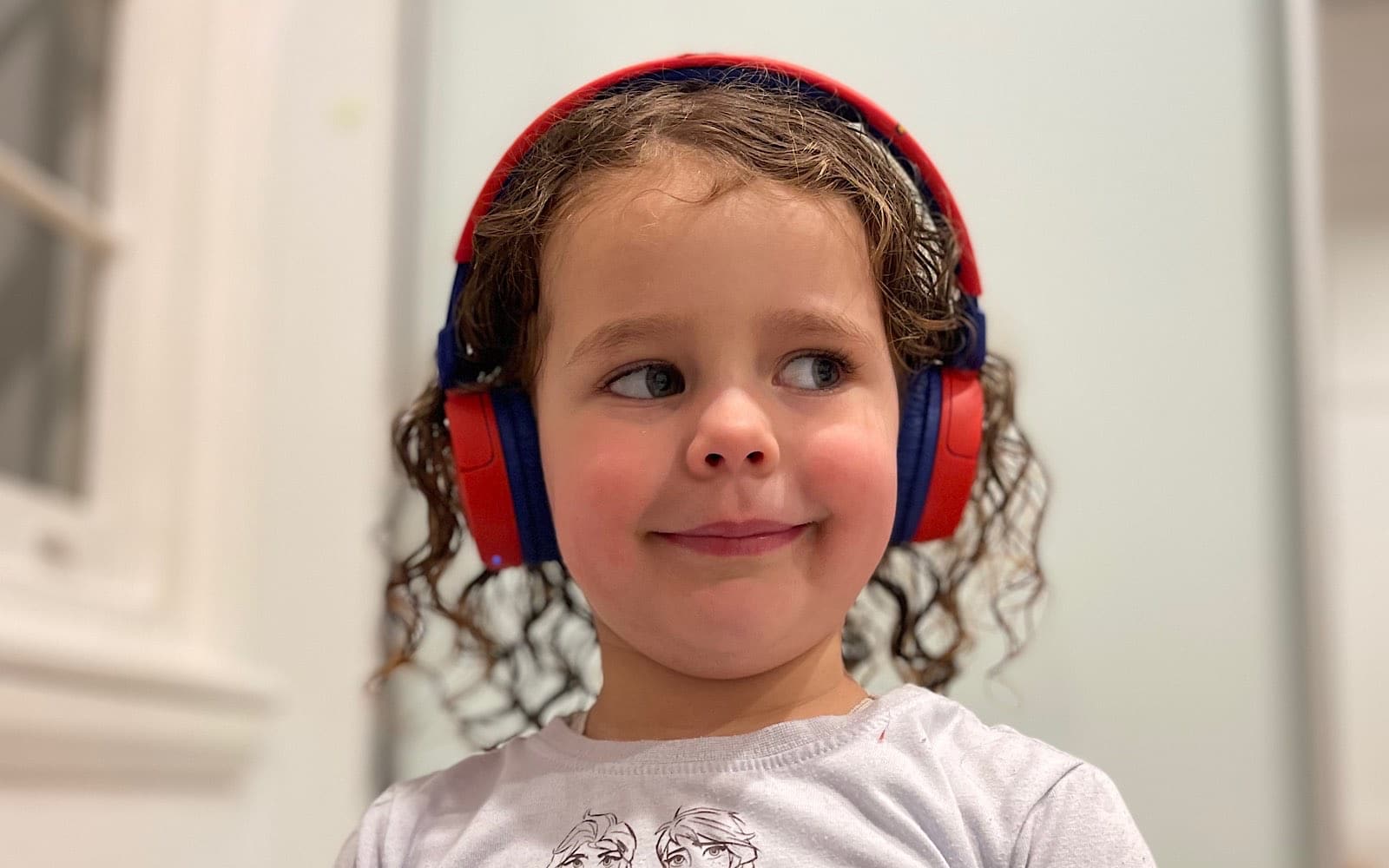 The little one wearing the JBL JR310BT headphones.