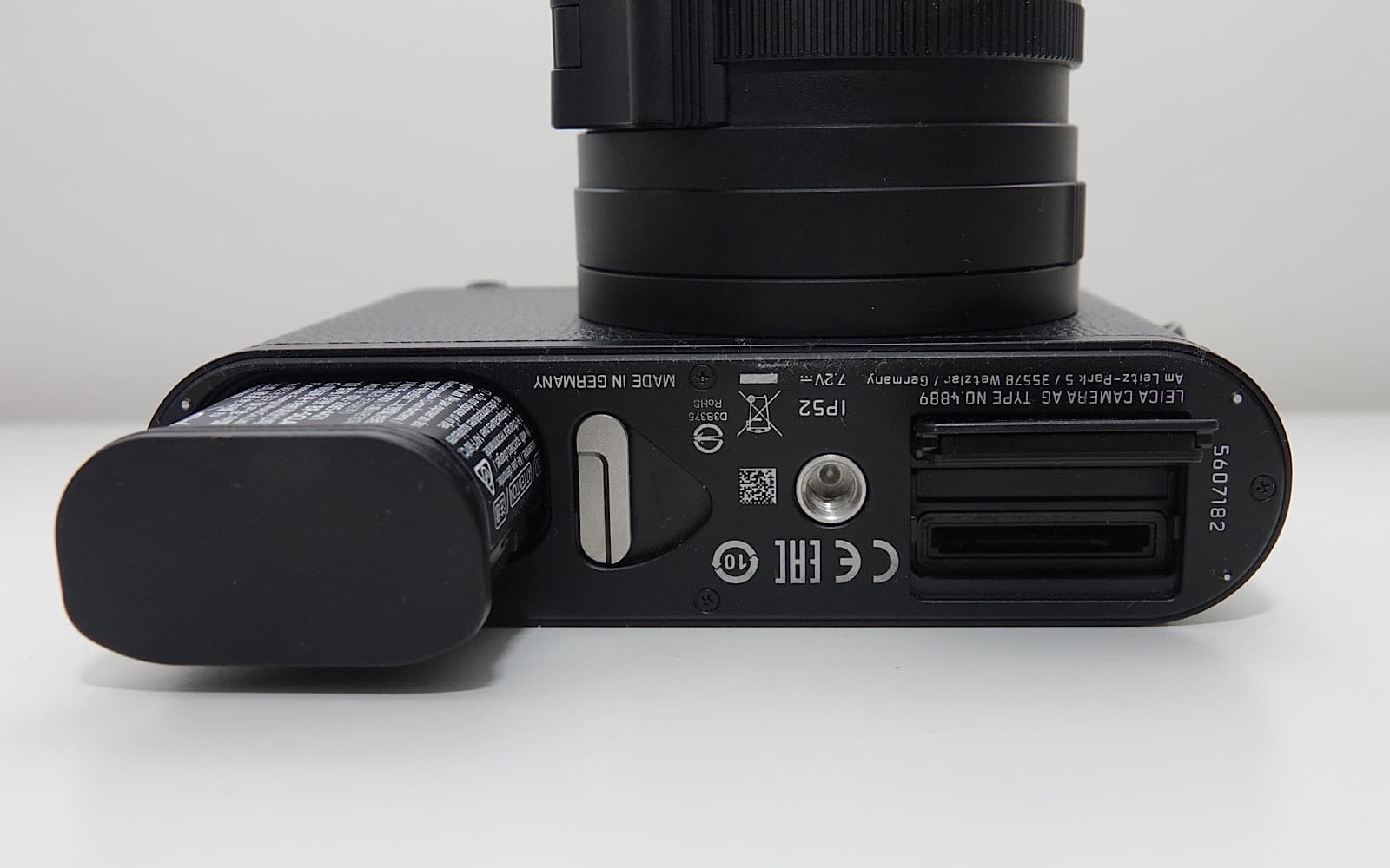 The battery and SD card latch at the bottom of the Leica Q2 Monochrom.
