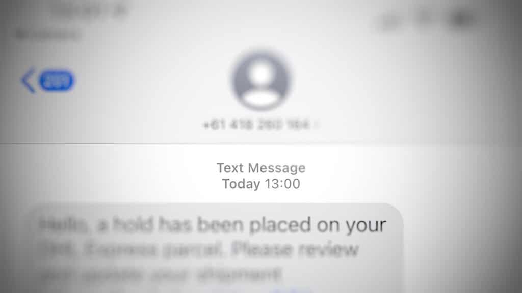 We've blurred the phone number, but clearly this text isn't from a real DHL sender.