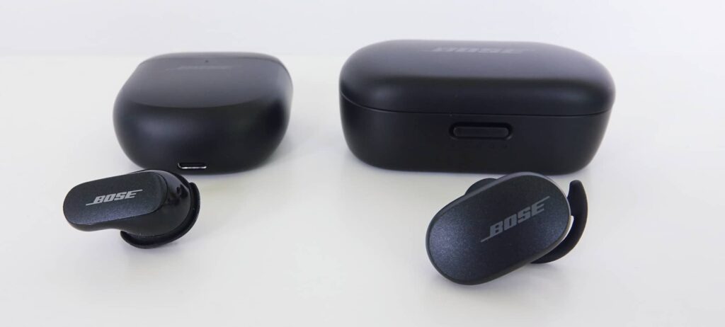 Both the earphones and the case for the Bose QuietComfort II Earbuds (left) are smaller than their respective counterparts in the original Bose QuietComfort Earbuds (right). 