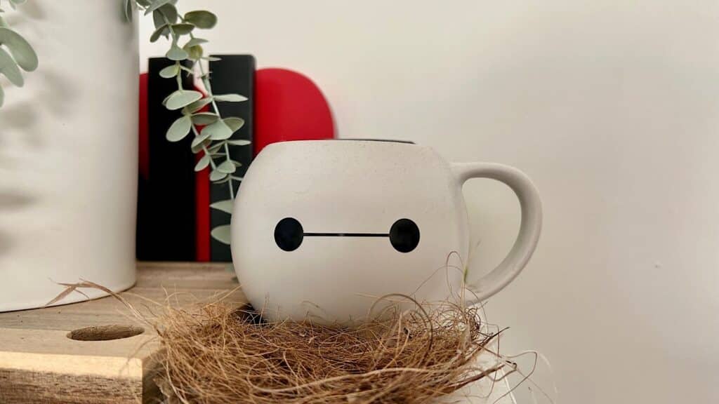A Baymax mug stares at people in the kitchen.