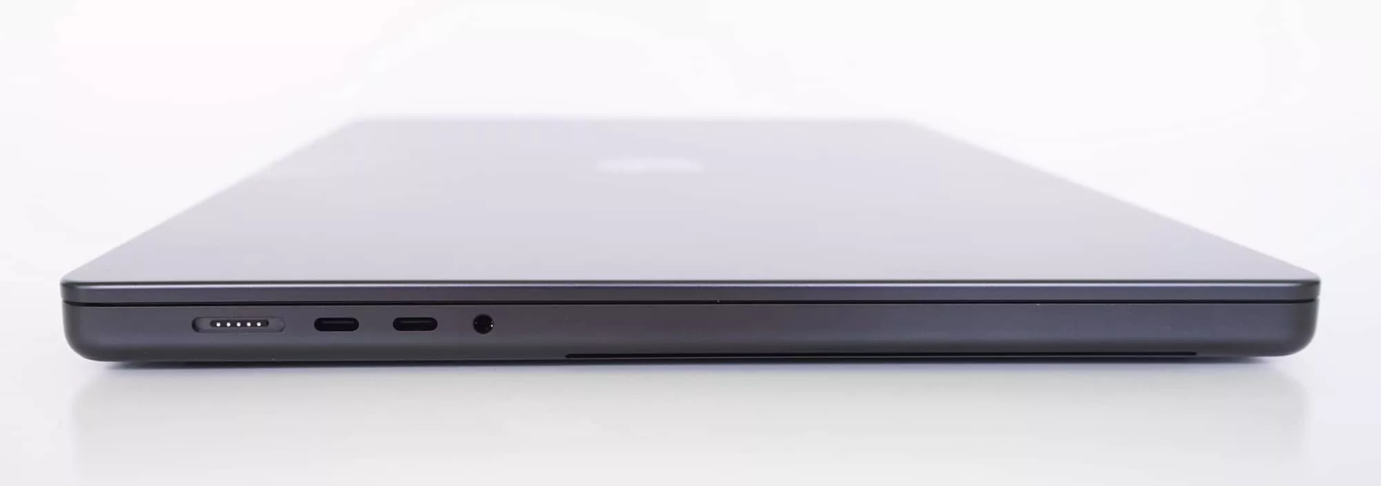 The left side of the MBP 16 with the MagSafe port, two Type C Thunderbolt 4 ports, and a 3.5mm headset jack.