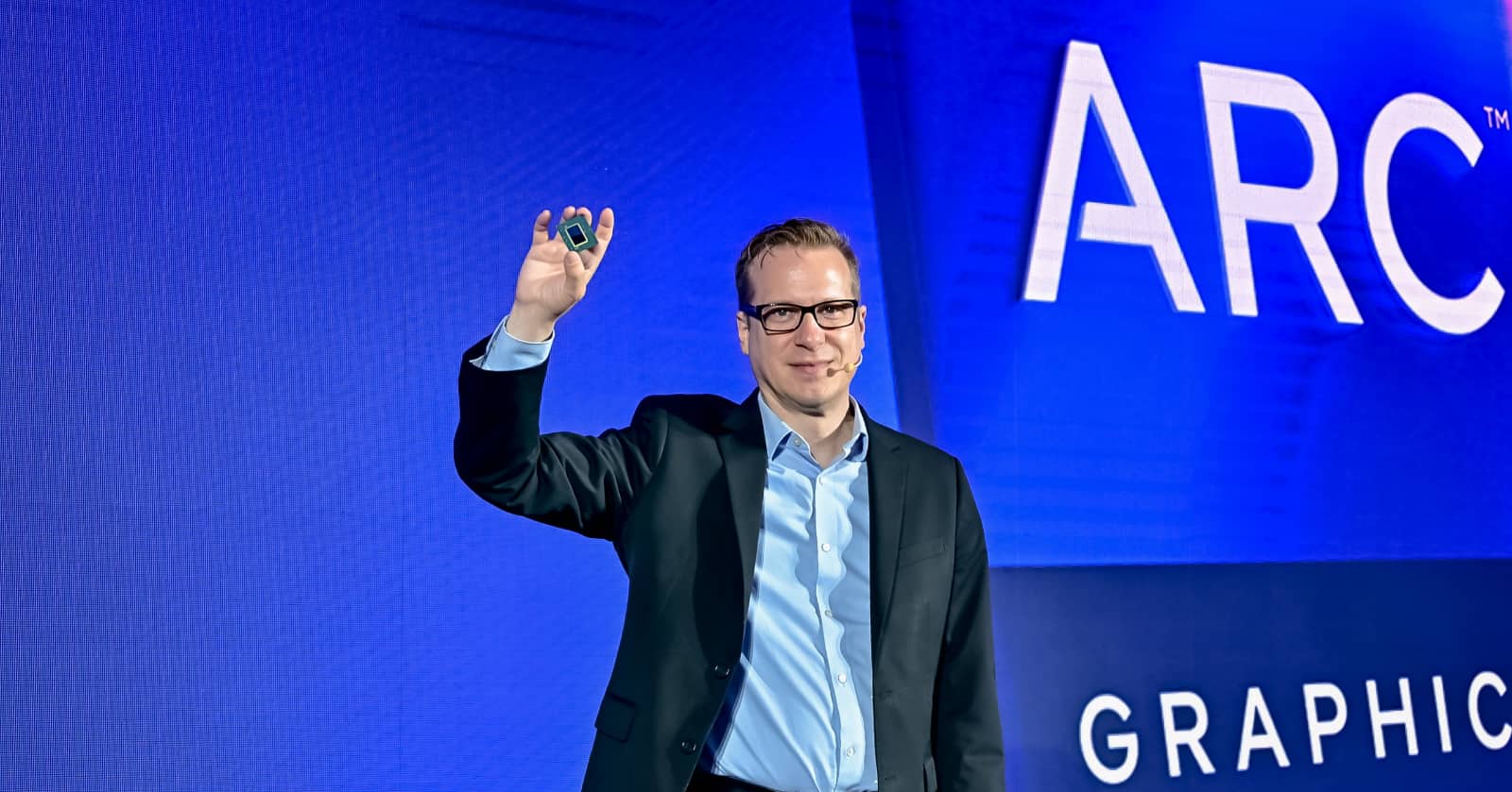 Intel's Jack Weast holds up the car-specific variant of the Intel Arc graphics chip.