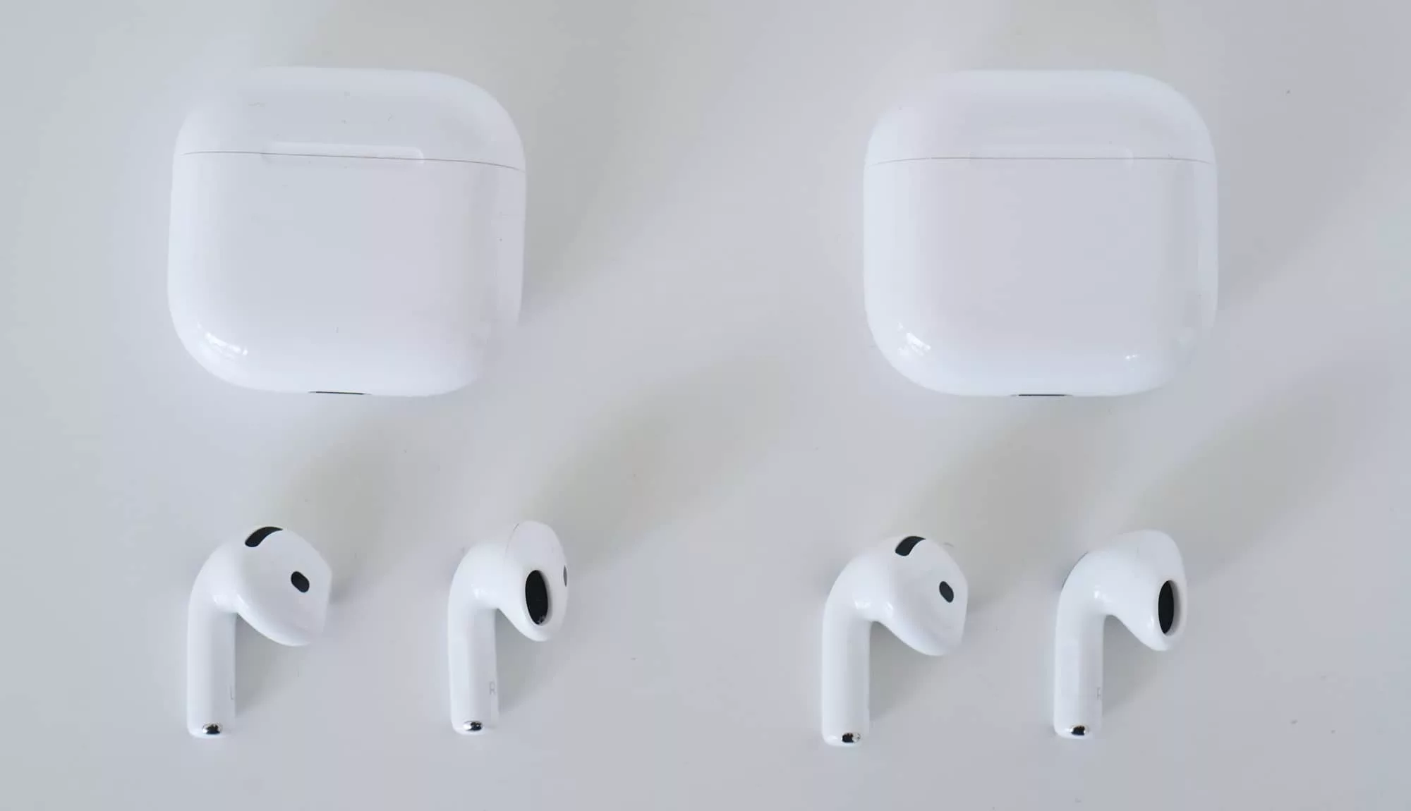 The AirPods 4 with ANC (left) and the AirPods 4 (right) look identical, except for maybe what's on the bottom of the case. 