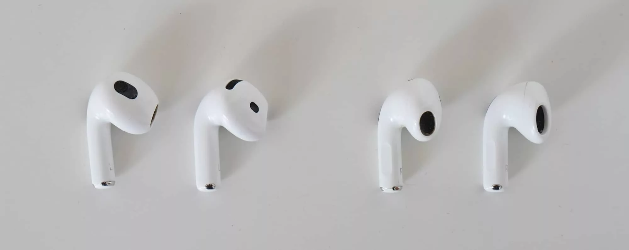 Check out the AirPods 3 on the left of each pair, compared to the AirPods 4 on the right of each pair.